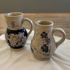 Two Vintage German Stoneware Blue and Cream Pitchers with Embossing